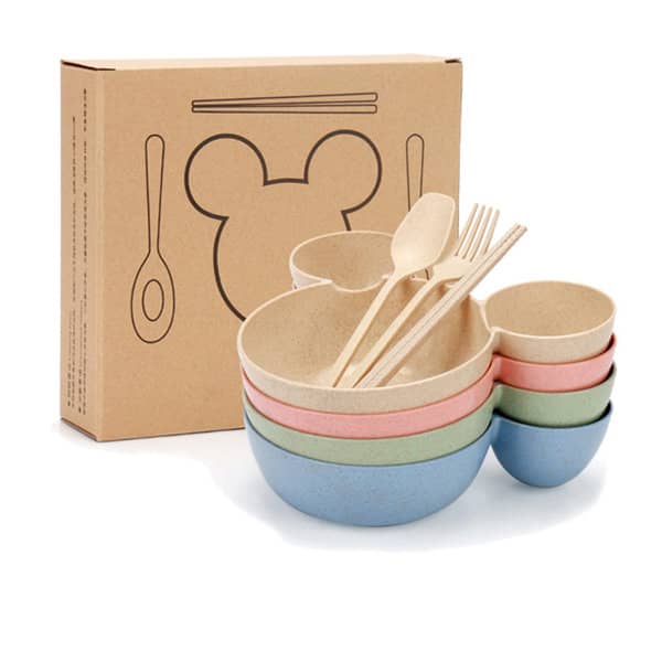 A set of wheat straw tableware including bowls and utensils in pastel colours, with a box featuring a logo. Big Ears Wheat Straw Tableware Set - Image 1