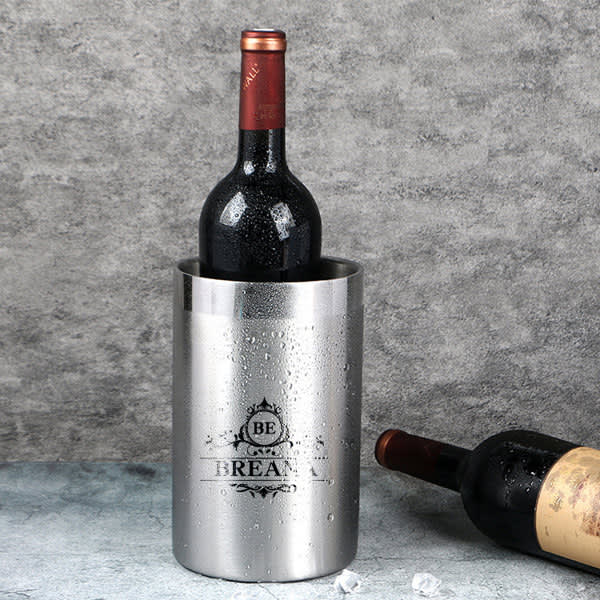 A stainless steel chiller bucket with a wine bottle inside, featuring a logo and water droplets on its surface. 1.6L Stainless Steel Chiller Bucket - Image 1