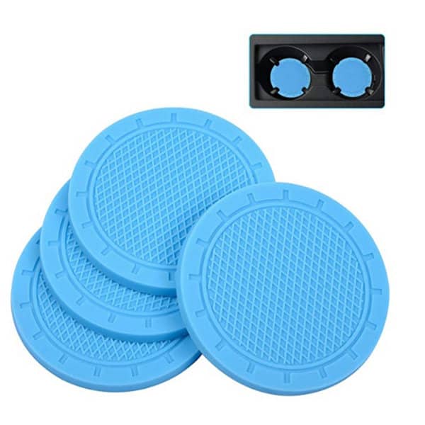 Four blue PVC car coasters arranged next to a black holder, featuring a textured surface. PVC Car Coaster - Image 1