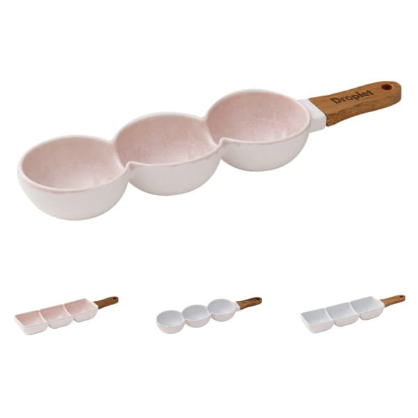 A pink and white handheld snack serving bowl with three compartments and a wooden handle. It features a branding logo. Handheld Snack Serving Bowl - Image 1