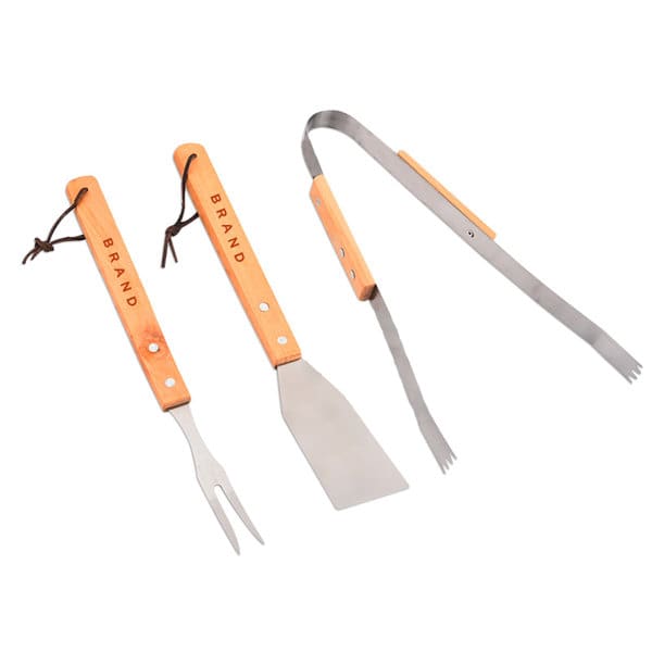 A three-piece BBQ tool set with wooden handles and stainless steel utensils, including a spatula, fork, and tongs. 3 Piece BBQ Tool Set - Image 1