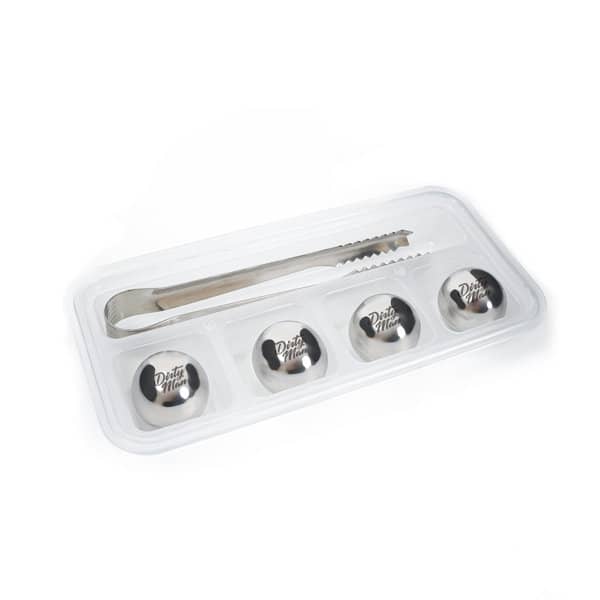 A set of four stainless steel ice stones and a tong, presented in a clear tray. The ice stones are silver. 4Pcs Set Stainless Steel Ice Stone With Tong - Image 1