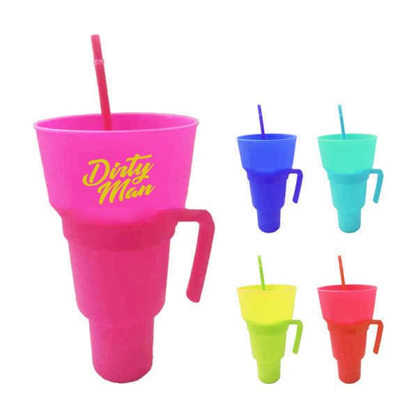 A pink plastic tumbler with a snack bowl and straw, featuring a handle, alongside tumblers in blue, green, and yellow. Stadium Tumbler With Snack Bowl - Image 1