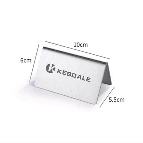 A stainless steel table sign with a sleek, polished finish, featuring a logo, measuring 10 cm by 6 cm. Stainless Steel Reserved Table Sign - Image 1