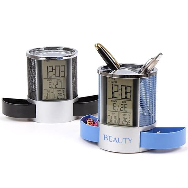 A mesh pen holder in silver with a digital LCD clock, available in black and blue, featuring pens inside. Mesh Pen Holder With Digital LCD Clock - Image 1