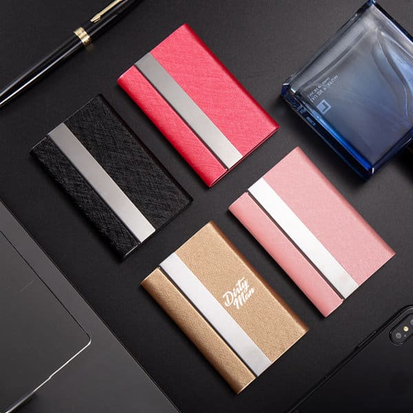 A set of four PU leather business card cases in black, pink, gold, and red, featuring metal accents. PU Leather Business Card Case - Image 1
