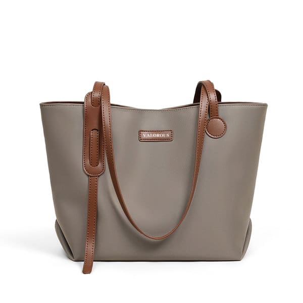 A large capacity tote bag in grey with brown straps and a logo on the front. Large Capacity Tote Bag - Image 1
