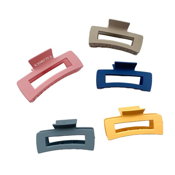 Five plastic square hair claw clips in pink, beige, blue, grey, and yellow, featuring a logo. Plastic Square Hair Claw Clip - Image 1