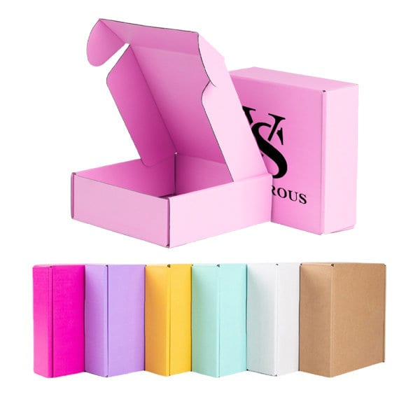A pink custom corrugated mailing box, open to show its interior, alongside boxes in various colours including purple, yellow, and white. Custom Corrugated Mailing Box - Image 1