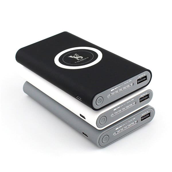 A wireless charging mobile power bank in black, grey, and white, featuring a logo and multiple USB ports. Wireless Charging Mobile Power Bank - Image 1