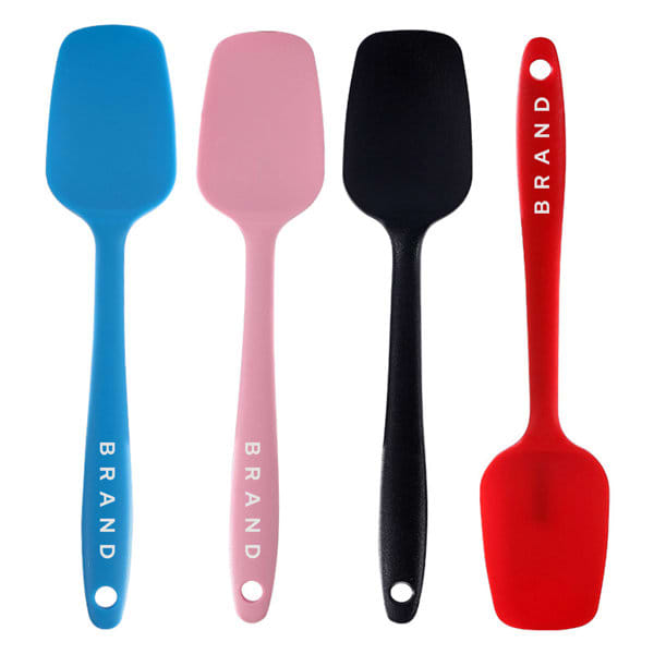 A set of four silicone T-shaped spatulas in blue, pink, black, and red, featuring branding on the handles. Silicone T Shaped Spatula - Image 1