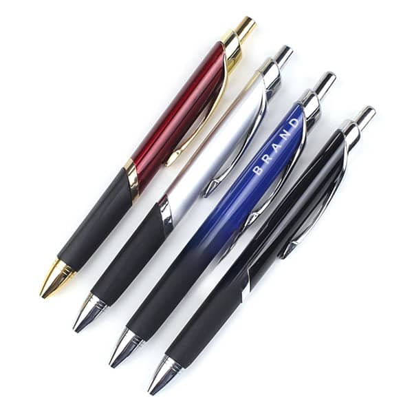 Four ballpoint pens with rubber grips in red, silver, blue, and black, each featuring a logo. Ballpoint Pen With Rubber Grip - Image 1