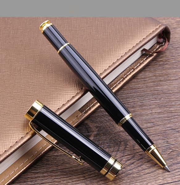 A black rollerball pen with gold accents, positioned alongside its cap, resting on a brown surface. Business Rollerball Pen - Image 1