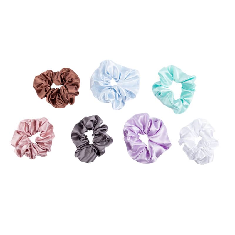 A collection of satin hair scrunchies in brown, pink, light blue, teal, grey, purple, and white. Satin Hair Scrunchie - Image 1