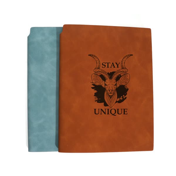 A brown PU leather notebook with a pen slot, featuring a design and an aqua blue cover on one side. PU Leather Notebook With Pen Slot - Image 1