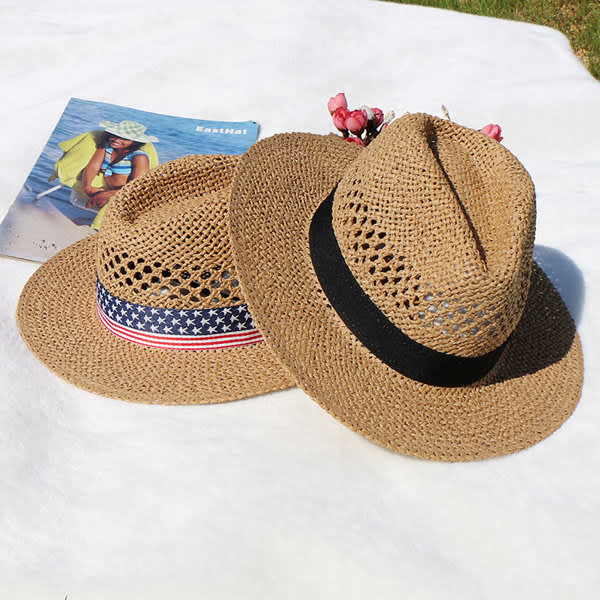 Two custom straw hats in brown, one with a red, white, and blue band, placed on a light surface with a magazine nearby. Custom Summer Straw Hat - Image 1