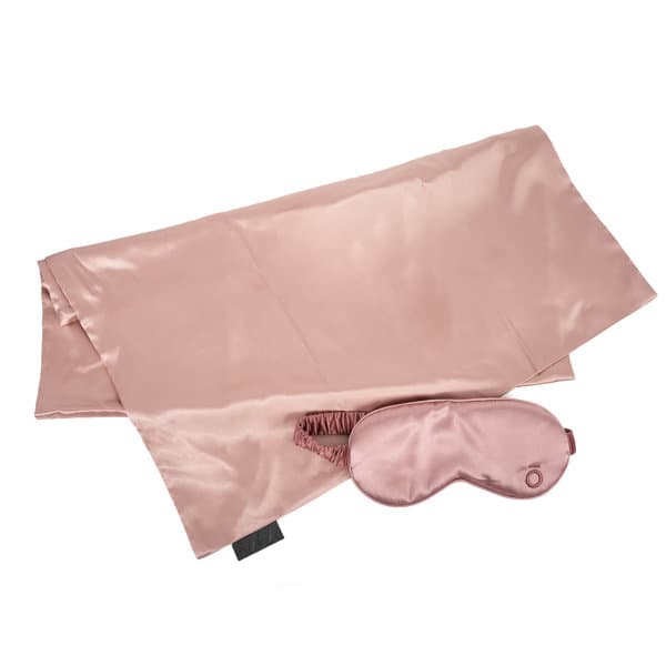 A satin pillowcase in rose pink paired with a matching sleep mask. The set features a logo on the mask. Satin Pillowcase Sleep Mask Gift Set - Image 1