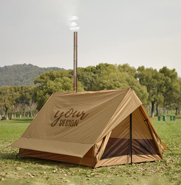 A tan camping wall tent featuring a stove jack, set in a grassy outdoor area with trees in the background. Camping Wall Tent With Stove Jack - Image 1