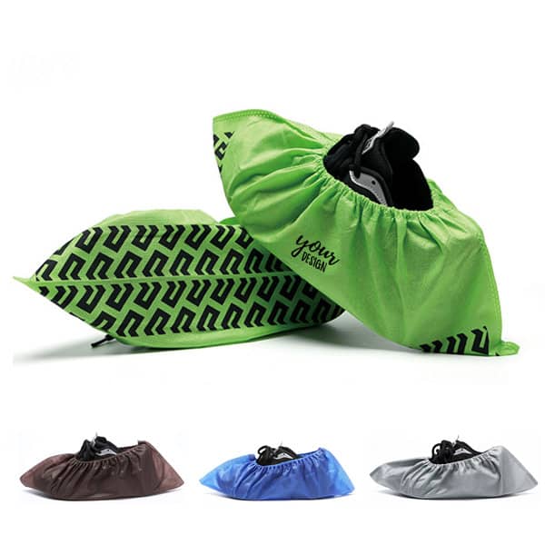 Non-slip reusable shoe covers in green with a logo, displayed with options in brown, black, and silver. Non Slip Reusable Shoe Covers - Image 1