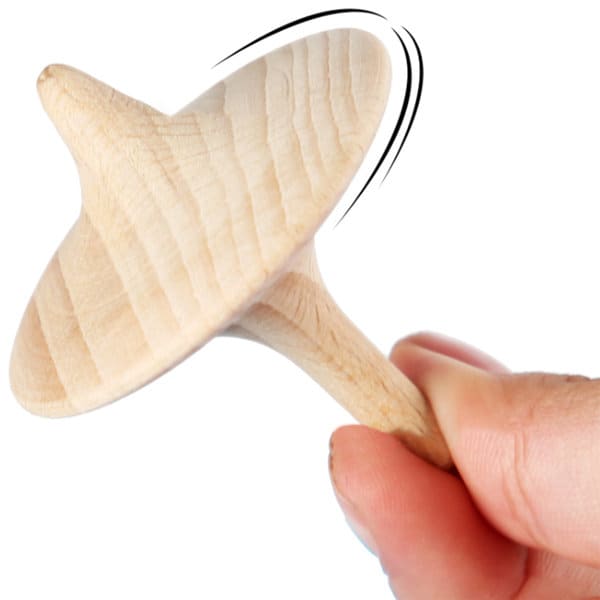 A solid beech spinning top held in a hand, showcasing its natural wood finish and smooth design. Solid Beech Spinning Top - Image 1