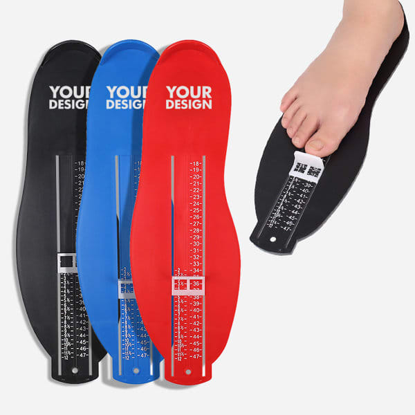 Foot measuring devices in black, blue, and red, with a scale for measuring foot length and a logo. One foot is placed on the device. Foot Measuring Device - Image 1