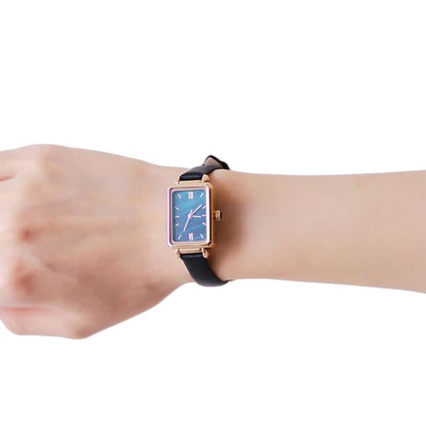 An elegant rectangular quartz watch with a blue face and a black strap worn on a wrist. Custom Women’s Elegant Rectangular Quartz Watch - Image 1