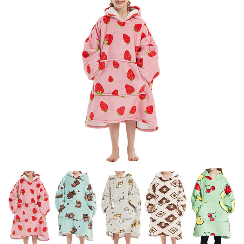 A pink flannel blanket hoodie with strawberry prints. Also available in mint, red, white, and brown patterns. Kids' Flannel Blanket Hoodie - Image 1