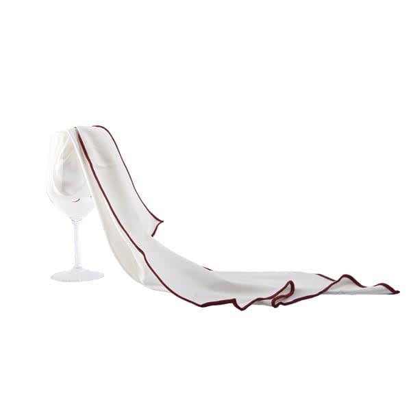 A white microfiber cloth with a burgundy trim draped over a wine glass. It features a subtle sheen and is soft to the touch. Microfiber Wine Glass Cloth - Image 1