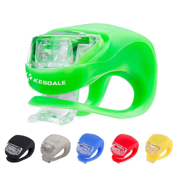 A green frog-shaped LED warning light with additional options in black, beige, blue, and red. It features a logo. Custom Frog Bicycle LED Warning Light - Image 1