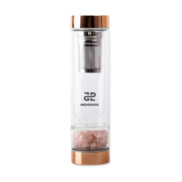 A drink bottle made of crystal glass with a rose gold lid and a tea infuser, featuring pink crystals inside. 17 oz. Crystal Glass Water Bottle With Tea Infuser - Image 1