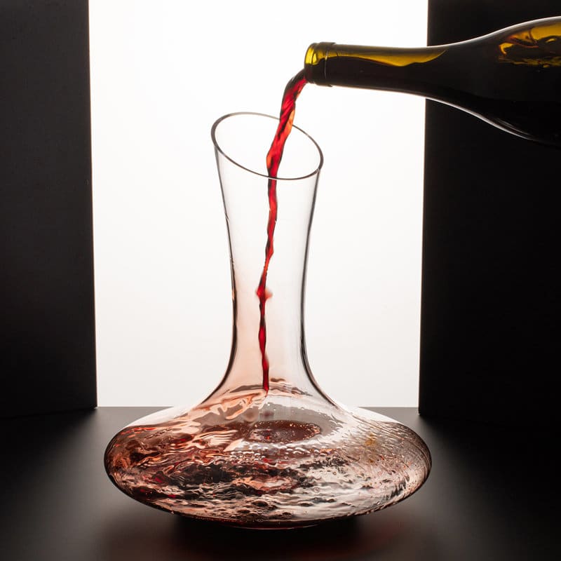 A glass red wine decanter with a wide base and narrow neck, coloured clear with a pouring bottle. 1.8L Red Wine Decanter - Image 1