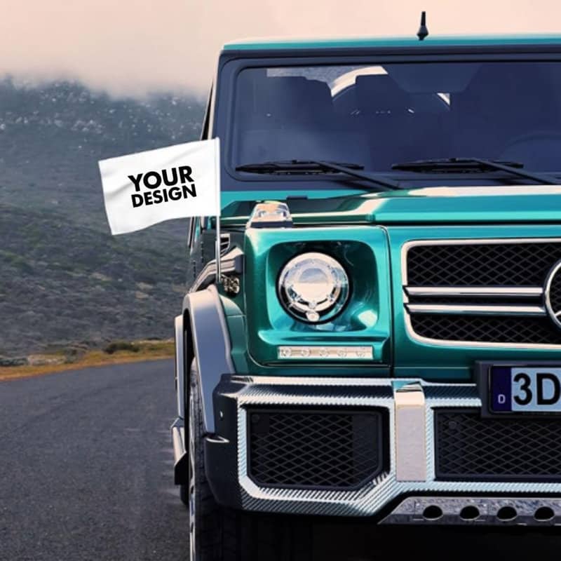 A custom car flag displayed on a teal vehicle, set against a mountainous backdrop. The flag features a design area. Custom Car Flag - Image 1