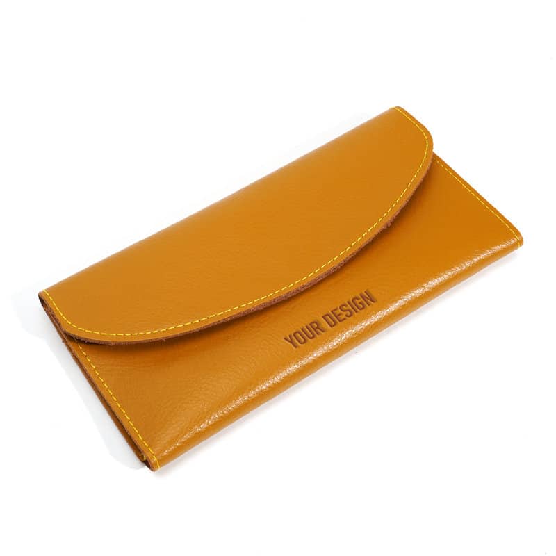 A mustard yellow women's genuine leather wallet with a flap closure and a logo. Women's Genuine Leather Wallet - Image 1