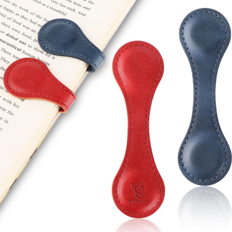 Two PU leather magnetic bookmarks in red and navy blue, each with a smooth finish, positioned on an open book. PU Leather Magnetic Bookmark - Image 1