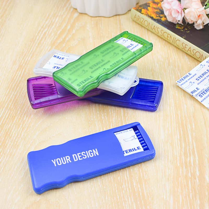Five adhesive bandage containers in purple, green, and blue, stacked on a wooden surface with floral decor. 5PCS Adhesive Bandages With Storage Container - Image 1