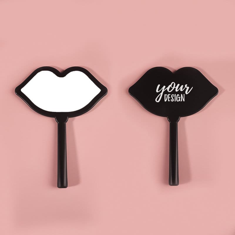 A lip-shaped hand mirror in black, featuring a smooth reflective surface on one side and a design space on the other. Lip Shape Hand Mirror - Image 1