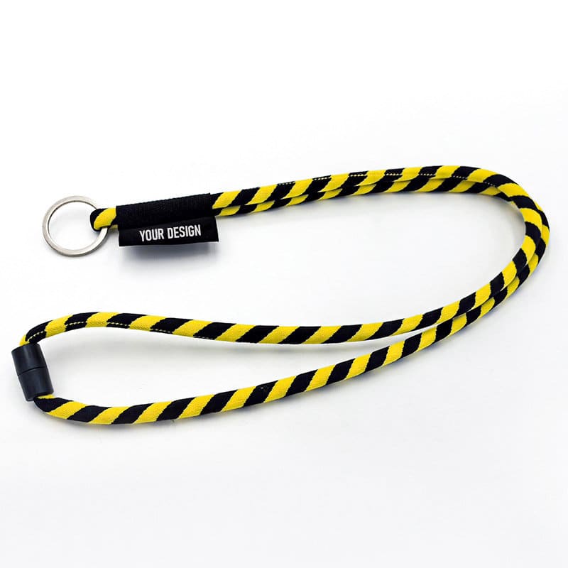 A customizable long lanyard featuring a braided black and yellow design, complete with a key ring attachment. Customizable Long Lanyard With Key Ring - Image 1