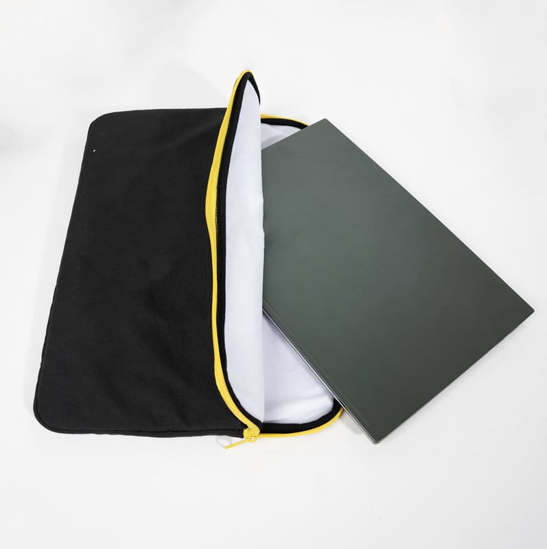 A black 14-inch protective laptop sleeve with a white interior and a yellow zipper, holding a laptop. 14-inch Protective Laptop Sleeve - Image 1