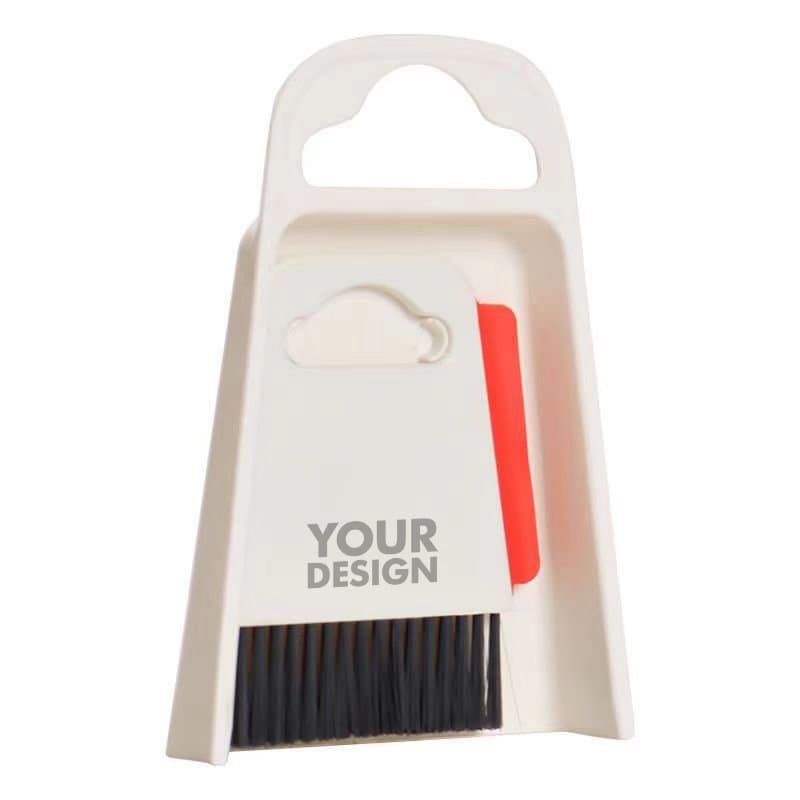A table cleaning brush with a black bristle head and a white dustpan featuring a handle and a red accent. Table Cleaning Brush With Dustpan - Image 1